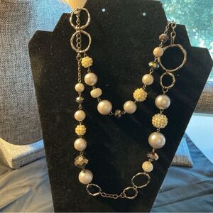 Erica Lyons  Brand. Brasstone Long Chain with Silvertone Beads and Baubles